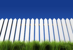 A white fence grass and blue sky - rendered in 3d
